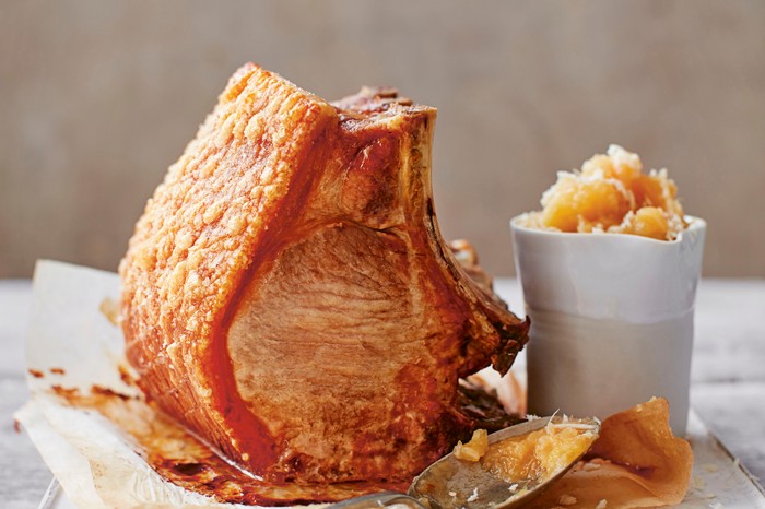 Roast pork loin next to a jar of apple horseradish