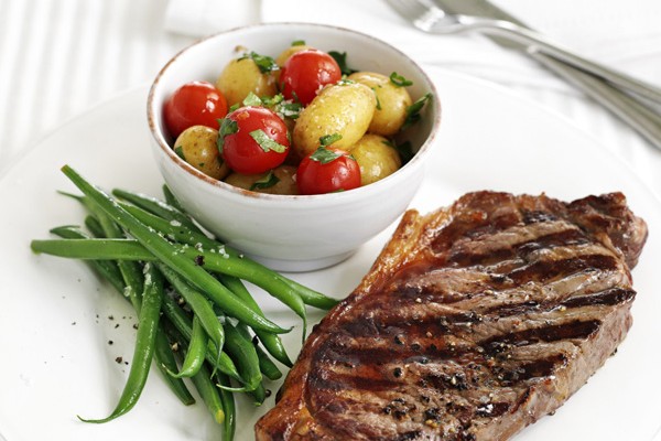 Lemon and pepper steak with warm potato salad