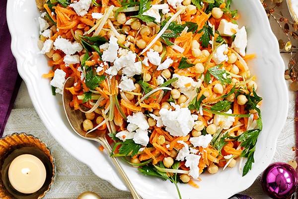 Carrot Salad Recipe with Chickpeas served on an oval white serving plate