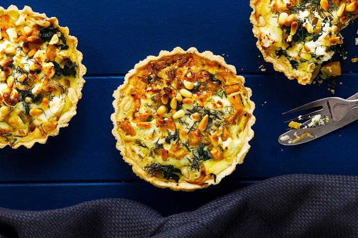 Individual squash, kale, caramelised onion and feta tarts