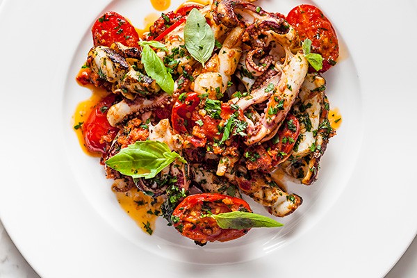 Charred squid with tomatoes