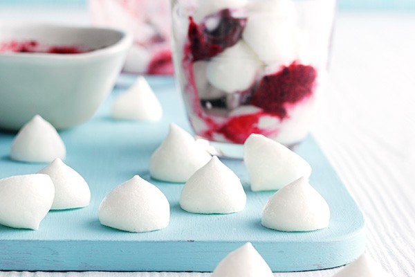 Vegan meringues on a surface and in a dessert