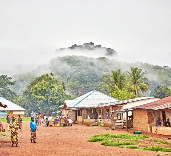 Huts bordering a street in Sierra Leone