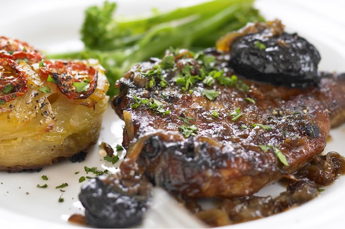 Braised pork chops with cider vinegar and prunes