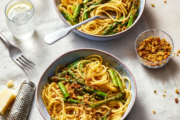 Asparagus and anchovy pasta Two bowls of asparagus spaghetti