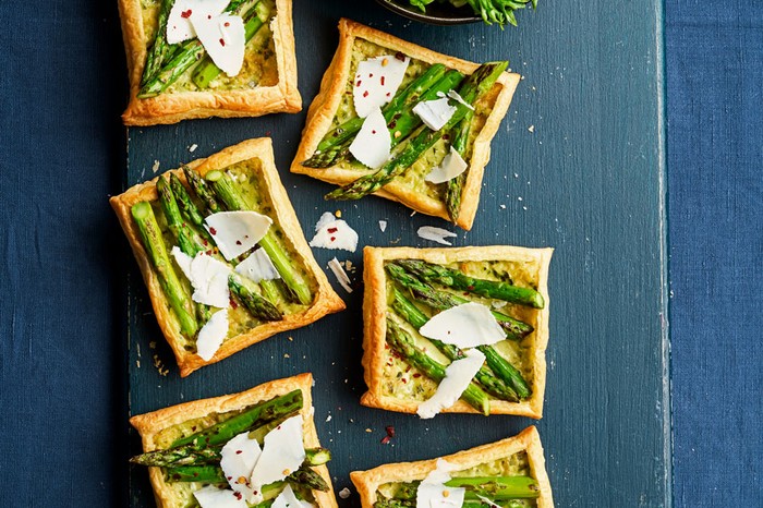 Board of asparagus and ricotta salata tartlets