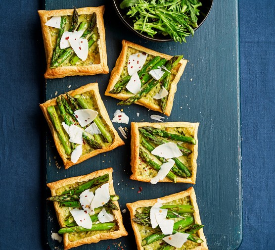 Board of asparagus and ricotta salata tartlets