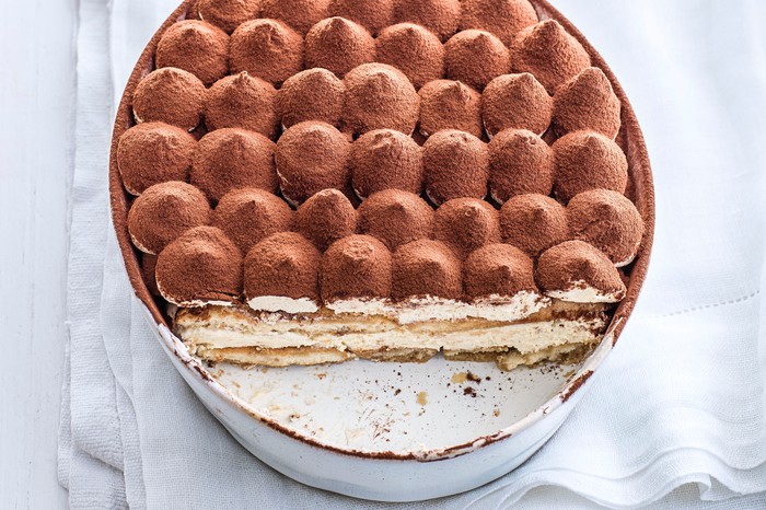 Baileys Tiramisu in a dish with a slice cut out