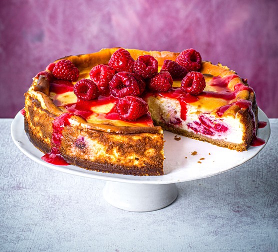 Baked raspberry cheesecake with slice taken out