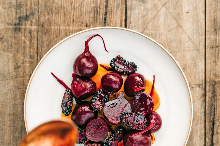 A plate of baked beetroots on a white plate