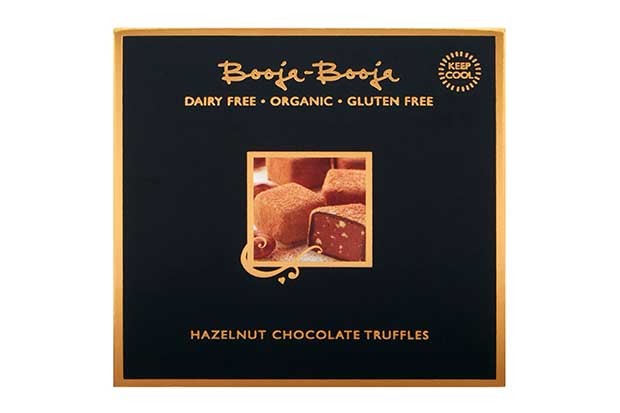 A black box with a gold rim with chocolate truffle photo on the front