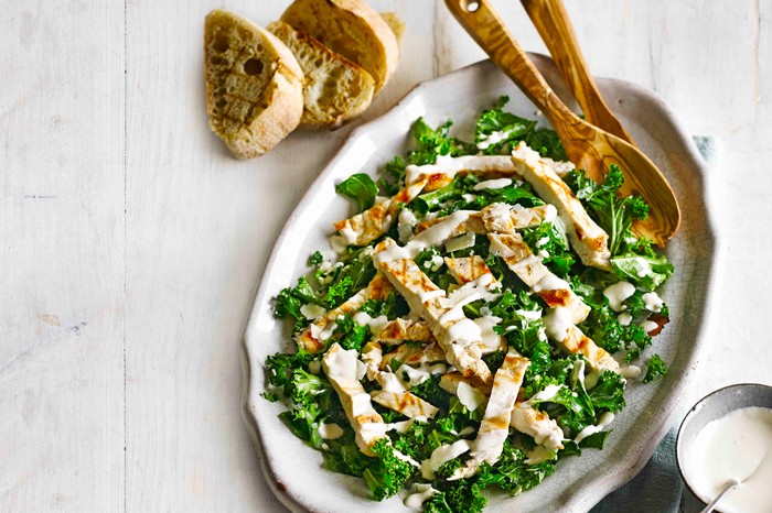 Kale Chicken Caesar Salad with strips of cooked chicken