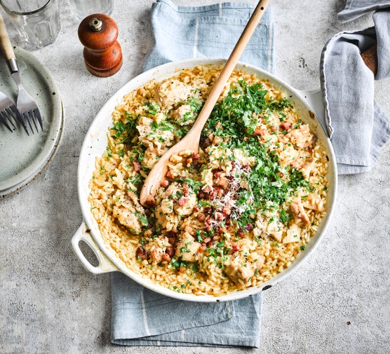 Chicken risotto A risotto in its cooking pan with herbs on top