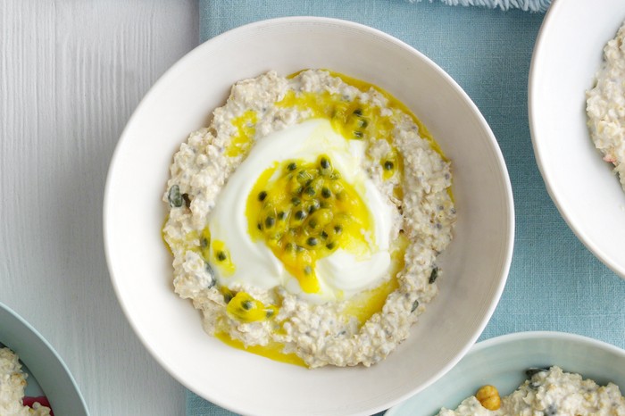 A Bowl of Coconut Overnight Oats topped with Yogurt and Passionfruit