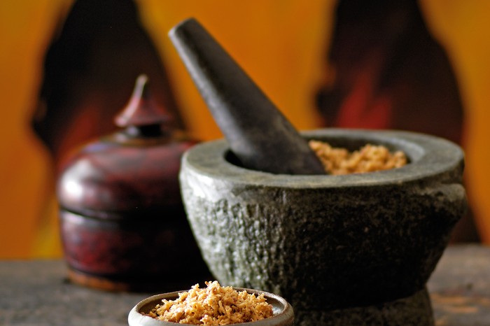 Coconut sambal in a pestle and mortar