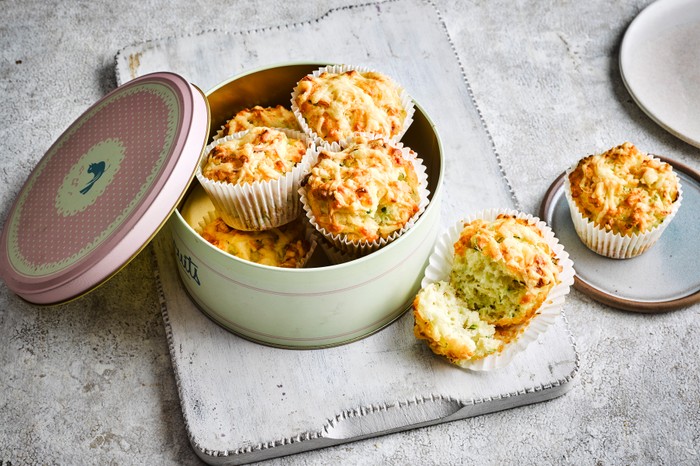 A batch of courgette muffins in a tin