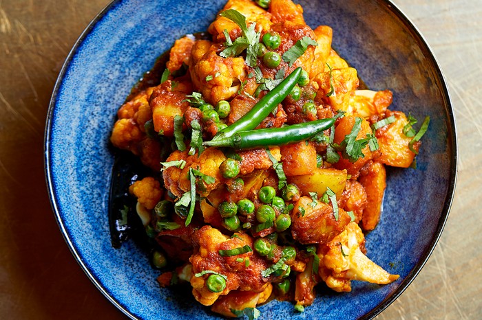 Darjeeling Express Aloo gobi on a blue plate