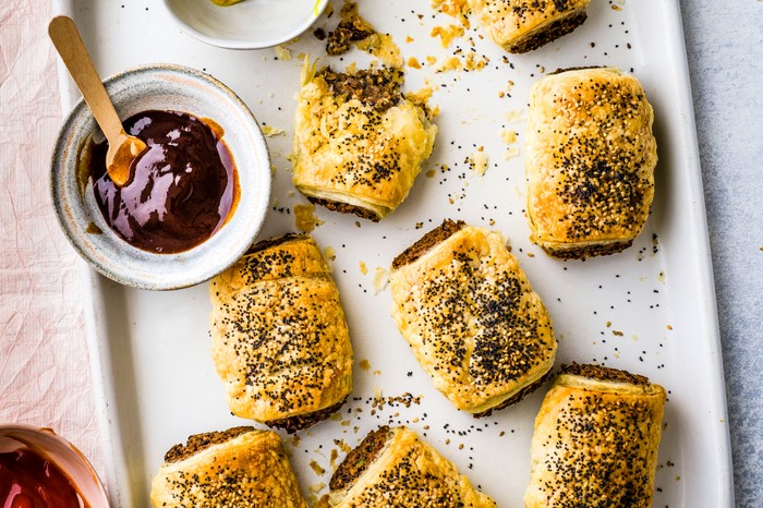 Best Healthy Picnic Food Vegan Sausage Rolls on a Baking Tray with BBQ Sauce for Dipping