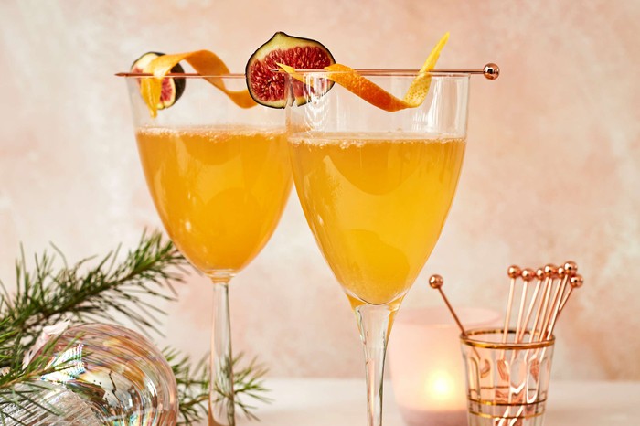 Two cocktails set against a festive background