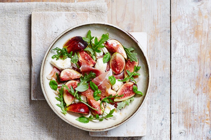 Fig, mozzarella and serrano ham salad Figs, mozzarella, and serrano ham salad on a plate