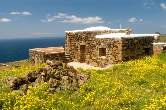 A Dammuso, traditional stone house of Pantelleria island, with roof used to collect rainwater.