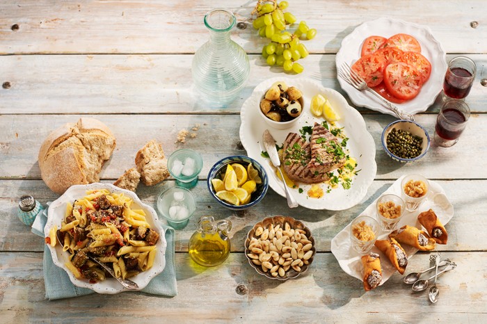 Sicilian lunch, including pasta alla norma, Pesce spada in salmoriglio, granita di caffe espresso, toasted almonds, cannoli