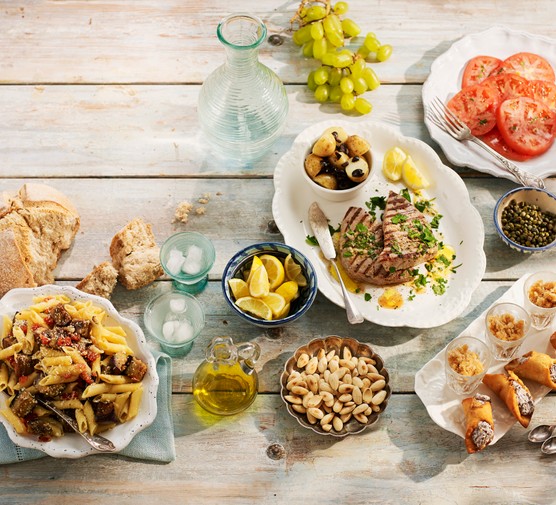 Sicilian lunch, including pasta alla norma, Pesce spada in salmoriglio, granita di caffe espresso, toasted almonds, cannoli