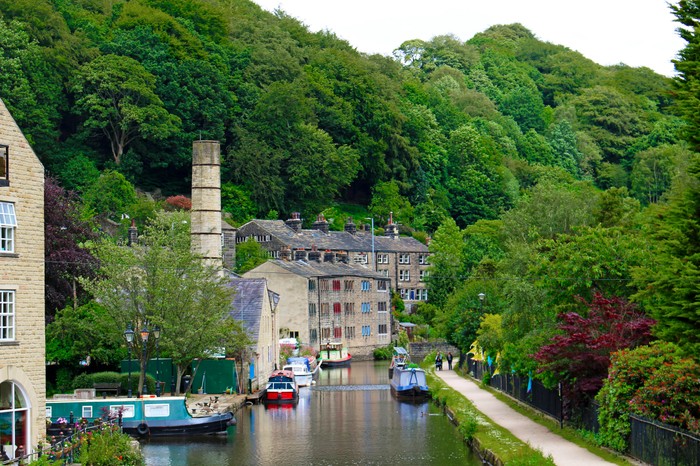 View looking down the River Calder in the revitalized industrial town of Hebden Bridge, Yorkshire, England. Hebden Bridge is known for being LGBT-friendly and for its concentration of independent shops.