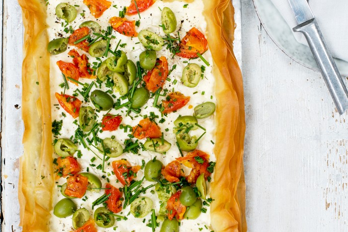 Goat's curd tart with olives and tomatoes