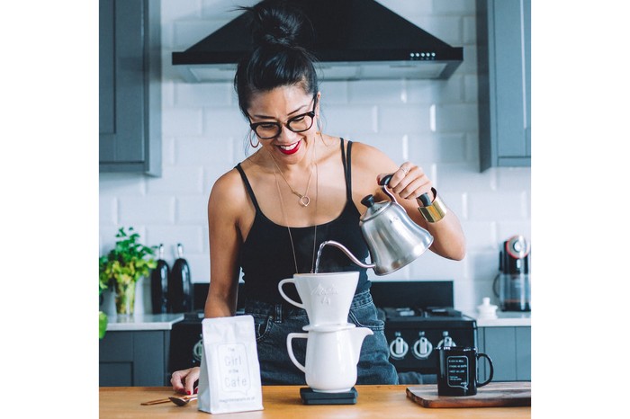 Celeste pouring water from a gooseneck kettle