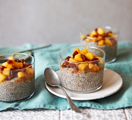 Cups of Chia Pudding Topped with Apple Chunks and Raisins