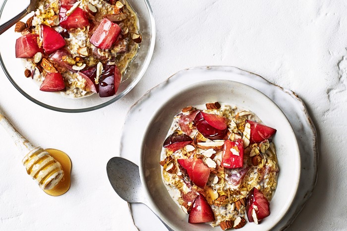 Two Bowls of Overnight Oats Topped with Plums and Almonds