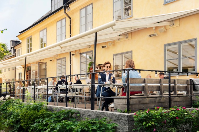 Hotel Skeppsholmen Stockholm yellow building with terrace