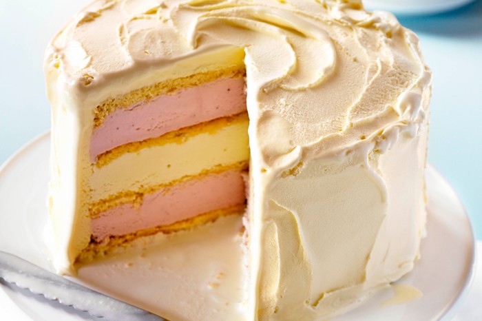 Ice cream cake Layered strawberry and white chocolate ice cream cake, with buttercream frosting