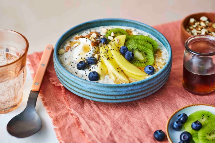 A bowl of overnight oats with fresh fruit on top