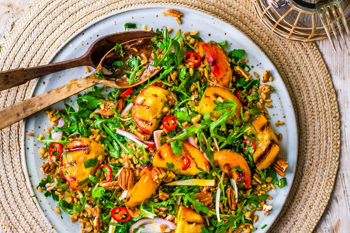 Grilled peach salad With pecans and farro