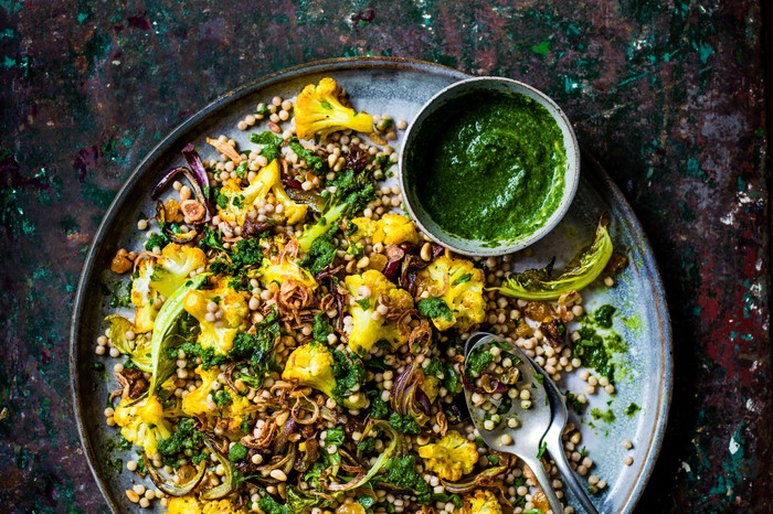 Roasted cauliflower and couscous salad with zhoug and crispy shallots