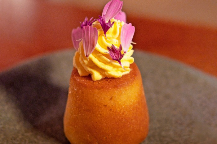 Kashmiri saffron baba Baba topped with chantilly cream and edible flowers