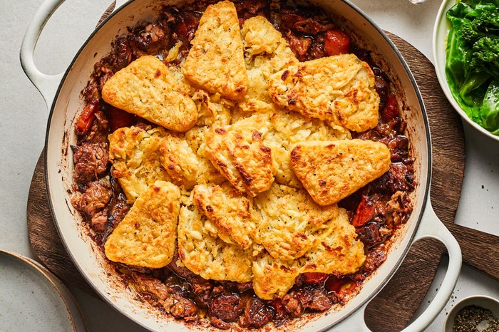 Lamb casserole in a pot topped with hash browns