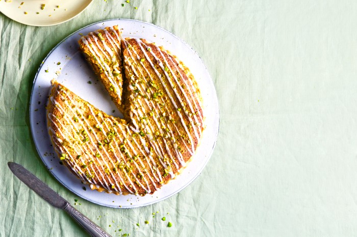 An iced bakewell tart with pistachios