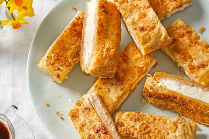 Stack of lemon and cream cheese pies on a plate