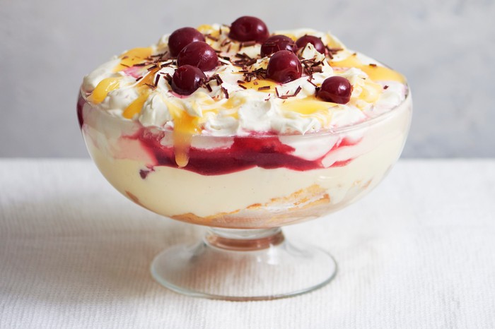 A large lemon trifle topped with cherries