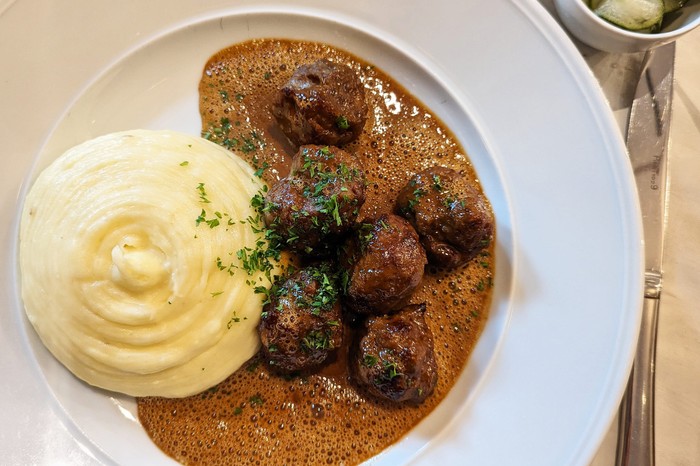 A plate of meatballs and mash potato at Sturehof