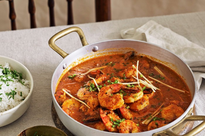 Prawn karahi A prawn curry in a wide casserole pan with rice on the side