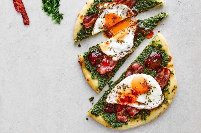 A colourful flatbread with a fried egg on top