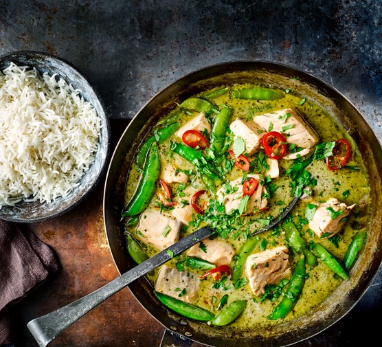 Green Thai Fish Curry in a Pan with Rice on the Side