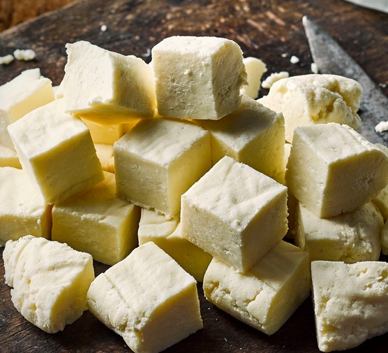 Homemade Paneer Recipe Homemade Paneer on a wooden board