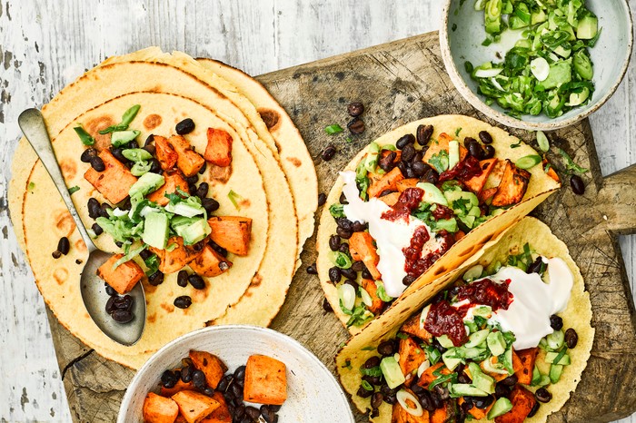 Tacos featuring sweet potato, black beans and coriander salsa