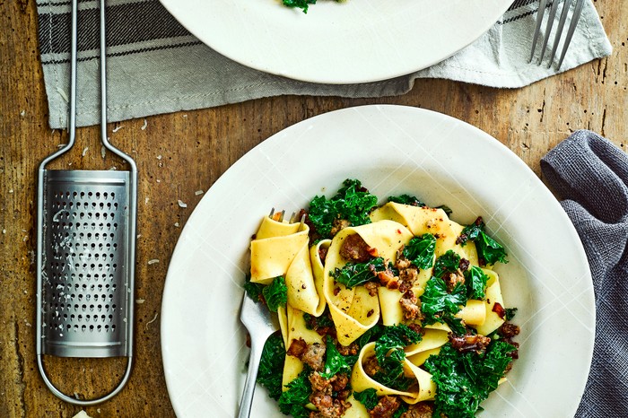 Sausage Pappardelle Recipe with Kale in a white bowl