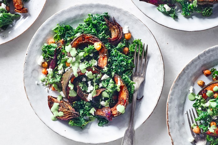 Roast pumpkin salad with chickpeas on two white plates